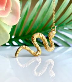 Gold Snake Necklace Alluring textured Turkish snake pendant necklace on a 14k gold chain Pendant: 2" Long Necklace: 12" Long in total Your necklace will arrive gift-wrapped! View more pendant necklaces!--> http://etsy.me/2lVN92R Shop Lauren Alleyne Jewelry on Etsy!--> http://etsy.me/2eFm9mK Gold Snake Necklace, Snake Pendant Necklace, Snake Jewelry, Gold Snake Charms, Serpent Charm Gold Snake Necklace, Gold Chain Pendant, Schmuck Gold, Snake Pendant, Gold Chain With Pendant, Snake Jewelry, Hippie Necklace, Snake Necklace, Gold Snake