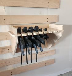 a bunch of tools are hanging on the wall