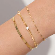 Add a little bling with our curb chain bracelet. 3 cubic zirconia gemstones set in the bracelet. Wear with our other bracelets for a more layered look.   - Waterproof, tarnish resistant & hypoallergenic- Made in gold vermeil: a thick 18k gold layer on sterling silver.- Adjustable chain 6 to 8 in.- Chain width: 2.4m Herringbone Bracelet, Curb Chain Bracelet, Gold Chain Bracelet, Bracelet Minimalist, Snake Bracelet, Bracelet Dainty, Dainty Bracelet, Gold Bead Bracelets, Gold Bracelet For Women