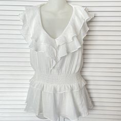 Dreamy Sleeveless Ruffled White Pullover Blouse By Do+Be. Nwot. Crisp White Polyester Gauze Fabric. Polyester Lining. No Stains, No Flaws. Excellent Condition! Elastic Waist. Size Xs. Machine Washable. Measurements: Pit To Pit 17” Elastic Waist Adjusts From 26-32” (Depending On Stretch) Hip 36” Back Length 26” Spring Beach Sleeveless Peplum Top, Feminine Sleeveless Peplum Top For Day Out, Sleeveless Peplum Top For Spring Vacation, Spring Sleeveless Peplum Top For Beach, Sleeveless Peplum Top For The Beach, Sleeveless Peplum Top For Beach In Spring, Sleeveless Peplum Top For Spring Beach Occasion, Spring Feminine Sleeveless Peplum Top, Feminine Sleeveless Peplum Top For Spring