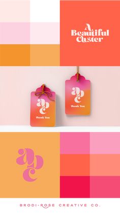 two tags with the letter g on them are hanging from clothes pins in front of an orange, pink and yellow striped background