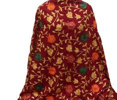 Pattern - red Kashmiri shawl with floral embroidery. Ideal for - women. Occasion - formal or casual. Fabric - cotts wool, it is a blend of cotton and wool which is very soft and has a fine texture. Color - maroon. On maroon background, embroidery is in different colored threads all over displaying floral patterns. Size - Width - 41 x 80 inches approx. Care- gentle hand wash. For more such scarves please visit- https://www.etsy.com/in-en/shop/vibrantscarves?ref=seller-platform-mcnav&section_i Red Pashmina Shawl With Motifs, Red Pashmina Shawl With Motifs And Traditional Drape, Red Pashmina Shawl With Motifs In Traditional Drape, Red Jamawar Pashmina Shawl With Motifs, Red Pashmina Shawl With Resham Embroidery, Red Shawl With Resham Embroidery In Traditional Drape, Embroidered Red Pashmina Shawl In Jamawar, Red Pashmina Dupatta With Resham Embroidery, Red Jamawar Pashmina Shawl