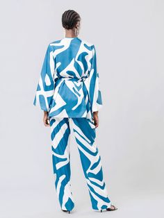 Our Mini Kimono is comfortable and convertible. Designed with a loose cut and a relaxed fit, this kimono is destination worthy and can be worn from day to night! Our removable sash belt and belt loops to secure closure allow for ease and adjustability. Cut for a loose, relaxed fit Removable waist sash belt Belt loops to secure closure Handcrafted in our small atelier in Dakar, Senegal 100% polyester jacquard SIZINGXS/S to 3XL CAREMachine wash cold with similar colors. Hang-dry. Small Atelier, Dakar Senegal, Waist Sash, Printed Jewelry, Sash Belts, Sash Belt, Plus Size Pants, Scarf Jewelry, Day To Night