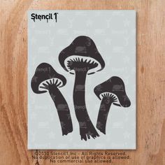 the stencil is designed to look like three mushrooms