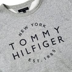 Nwot Tommy Hilfiger Sweatshirt Crewneck New York Spell Out Athleisure Est. 1985 Color: Gray Style #: Crewneck Sweatshirt Size: Adult Large Condition: Nwot Authenticity: 100% Smoke-Free Home Discount For Bundles Of Two Or More Items... Fast Shipper! Please Ask If You Have Questions Sporty Gray T-shirt For Fall, Sporty Branded T-shirt For Fall, Cotton Tops With Logo For Loungewear, Sporty Logo Tops For College, Logo Cotton Tops For Loungewear, Gray Winter Loungewear T-shirt, Tommy Hilfiger Cotton College Tops, Tommy Hilfiger Casual Tops For College, Casual Tommy Hilfiger Tops For College