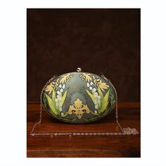 This is one of a kind handcrafted bag which is handcrafted to order. As it is a handcrafted product, it may have slight irregularities or imperfections.  MEASUREMENTS Length - 17.78cm Width - 22.86cm Handle - 57.15cm This clutch can be worn as a crossbody bag or a shoulder bag with the sling chain or can simply be carried in hand. It is spacious enough to carry mobile phones, cosmetics, keys and other small accessories. Unique Evening Clutch Bag, Handmade Pouch Shoulder Bag For Formal Occasions, Handmade Formal Pouch Shoulder Bag, Unique Handmade Evening Bags, Elegant Hand Painted Rectangular Bag, Elegant Hand Painted Rectangular Bags, Unique Shoulder Bag For Gift, Handmade Unique Green Bags, Green Handheld Shoulder Bag For Wedding