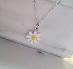 Cute silver plated daisy charm necklace  Dainty daisy necklace minimalist, boho necklace, cute silver necklace bohemian, birthday gift for friend, summer jewellery, flower necklace https://www.etsy.com/uk/shop/GillsEnchantedCloset The necklace is 18 inches (45.7cm) in length and 1.2 mm in thickness.   Each necklace comes packaged in a self seal packet and in an organza bag, making it perfect as a gift, whether that be for a Birthday or as a just because gift. Dainty daisy necklace minimalist, bo Trendy Handmade Charm Necklaces As Gift, Trendy Sterling Silver Round Pendant, Trendy Pendant Charm Necklace Gift For Her, Trendy Pendant Charm Necklaces As Gift For Her, Trendy Pendant Charm Necklace For Her, Trendy Pendant Charm Necklaces For Her, Trendy Sterling Silver Charm Necklace As A Gift, Trendy Flower Shaped Jewelry For Gifts, Cute Sterling Silver Pendant Charm Necklace