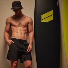 Our Split Hem Board Short is made in a soft and supple water repellent stretch nylon. Style details include an elasticized waistband with drawcord, slash pockets, a single back pocket with velcro closure, a locker loop detail at center back waistband and side slits. Suitable for mixed end use. Additional Information:• 85% Nylon, 15% Spandex• Machine wash cold, line dryStyled With:• SMTSU8360 - Men's Suede Flip Flop Relaxed Fit Nylon Swim Trunks With Side Pockets, Black Bottoms With Built-in Shorts For Water Sports, Functional Relaxed Fit Swim Trunks With Pockets, Sporty Swimwear With Elastic Waistband And Relaxed Fit, Sporty Nylon Swim Trunks With Functional Drawstring, Sporty Nylon Swim Trunks With Relaxed Fit, Athleisure Nylon Swim Trunks With Side Pockets, Sporty Swimming Shorts With Side Pockets, Athleisure Solid Swimwear With Functional Drawstring