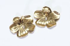 Chanel Paris Camellia Earrings.Vintage Chanel Paris gold plated Camellia flower earrings in excellent condition. Collectors item! Approximate Measurements: Diameter 1.75" Made in France. Evening Flower-shaped Gold Earrings, Gold Flower Earrings For Evening, Vintage Yellow Gold Flower Shaped Earrings, Vintage Yellow Gold Formal Flower Earrings, Vintage Yellow Gold Flower Earrings For Formal Occasions, Flower Shaped Clip-on Earrings For Evening, Vintage Yellow Gold Flower Earrings, Vintage Gold Flower-shaped Earrings, Vintage Gold Flower Shaped Earrings