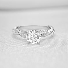 Shown in 1.0 Carat * The Amelia Diamond Twist Engagement Ring | Lisa Robin#_shape-round Ring With Twisted Band, Twist Band Rings, Twisted Infinity Engagement Ring, Twisted Ring Engagement, Small Diamond Ring Engagement, Simple Elegant Engagement Rings Vintage, Engagement Rings Low Profile, Twist Band Engagement Rings, Unique White Gold Engagement Rings