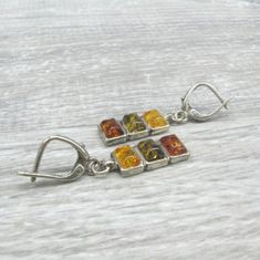 Baltic Amber rectangle bar Earrings geometric dangle earrings. vintage item made in the 1980s. Very good condition. These earrings look very stylish and up to date. They can be used as daily wear office jewelry or coworkers gift. Full length: 1.38 inches or 35 mm from ear hole to the bottom. Natural amber rectangular dangles measure 7 X 22 mm. Each earring has 3 rectangular amber cabochons in yellow, moss green and honey color, measuring 4 X 6 mm. High quality 925 sterling silver setting. I have Retro Rectangular Earrings For Gift, Yellow Rectangular Earrings As A Gift, Yellow Rectangular Earrings For Gifts, Rectangular Yellow Earrings For Gift, Yellow Rectangular Earrings Gift, Retro Sterling Silver Earrings For Gift, Retro Sterling Silver Earrings Gift, Office Jewelry, Honey Color