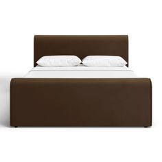 a bed with white pillows and brown headboard