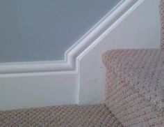 the corner of a carpeted stair case