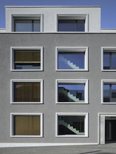 a building with many windows and steps leading up to it