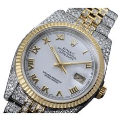 Rolex Datejust 36mm White Roman Dial Fluted Yellow Gold Bezel Iced Out Watch Jubilee Band 116233 This watch comes with a LIFETIME diamond replacement warranty. We are so confident in our diamonds setters that if any of the individual diamonds are ever to fall out of our watches, we will replace them free of charge for a lifetime. Minimum carat total weight 25.00 Ct. Average color- F. Average clarity - VS. Formal Yellow Gold Diamond Watch With Rectangular Dial, Yellow Gold Diamond Watch With Rectangular Dial, Womens Rolex Watches Gold, Yellow Gold Diamond Watch With Jubilee Bracelet, Gold Watches With Jubilee Bracelet And Rectangular Dial, Emerald Cross, We Watch, Modern Watches, Cross Jewelry