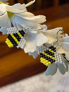 This beautiful and unique beaded earring honors the hard working pollinator, that is the bee.  Each earring is the size of a US dime and is crafted with Miyuki Delica beads. Beaded Bumble Bee, Miyuki Delica Beads, Beaded Earring, Bee Earrings, Bead Pattern, Delica Beads, The Bee, Hard Working, Brick Stitch