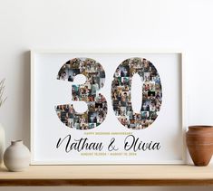 a white framed photo with the number 50 on it is sitting next to vases and a potted plant