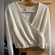 New With Tags Madewell Wrap Top In Beautiful Ivory Color. Top Features Wrap Design And Is Perfect For An Elevated Every Day Look. Fits True To Size. Does Not Have Button Closure For Front Wrap. Free Shipping In Usa. Cream Cotton Tops For Layering, Off White Tops For Fall Loungewear, Off White Tops For Loungewear In Fall, Off White Cotton V-neck Top, Off White Long Sleeve Tops For Loungewear, Cream Cotton Tops For Loungewear, Off White Spring Loungewear Top, Off White Cotton Loungewear Tops, Off White Cotton Tops For Loungewear