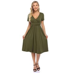 This dress features a V-neck design for a stylish and flattering look. Chic V-neck Wrap Dress For Day Out, Flattering V-neck Wrap Dress For Summer, Summer V-neck Dress With Surplice Neckline In Solid Color, Chic V-neck Solid Color Midi Dress, Spring V-neck Stretch Dress With Surplice Neckline, Flattering V-neck Summer Dresses, Chic Green V-neck Dress With Surplice Neckline, Flattering V-neck Dress For Date Night, Stretch Dresses With Surplice Neckline In Solid Color