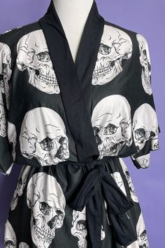 Our new Skull Study print robe is just the thing for Goth Ghoul summer! You can wear this as a dress or as a cover up by the pool. It's made from super soft peachskin jersey fabric. With a black belt to bring you in at the waist. Available in 2 sizes Small/Medium & Large/X-Large This is a made to order item which means it ships separately from the other items in my shop and takes up to 2 weeks to make and ship to you . No discounts can be used on made to order items. Black Halloween Beach Dresses, One Size Black Cover-up For Summer, Black One-size Summer Cover-up, Black Summer Sleepwear, Black Graphic Print Summer Sleepwear, Black Graphic Print Sleepwear For Summer, Summer Black Sleepwear With Graphic Print, Beach Dresses With All Over Print, Summer Beach Wrap Sleepwear