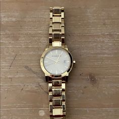 Stunning Gold Burberry Watch! As A Note It Comes With A Box! Burberry Watch, Note It, Tory Burch Tote, Grey Sunglasses, Burberry Accessories, Floral Bags, Unisex Watches, Black Leather Bags, Burberry Women