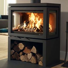 a fire place with logs in it