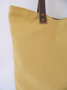 Everyday large casual shoulder tote bag in mustard yellow and charcoal gray colorblock combo with brown real leather handles. Fall/Winter work office school laptop heavy duty handbag. *Exterior: - Bottom - high quality thick and very durable natural cotton in dark charcoal gray - Top - beautiful mustard yellow thick and very durable natural cotton * Interior - Fully lined with dark gray thick natural cotton * Two inside slip pockets for daily belongings like phone, keys, etc. * Brown real leathe Yellow Canvas Shoulder Bag With Double Handle, Modern Yellow Satchel Tote, Modern Yellow Tote Satchel, Yellow Double Handle Canvas Shoulder Bag, Yellow Canvas Tote Shoulder Bag, Yellow Canvas Shoulder Bag With Handles, Yellow Canvas Shoulder Bag For Daily Use, Yellow Satchel With Handles For Everyday Use, Yellow Canvas Shoulder Bag For Everyday