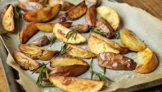 roasted potatoes with rosemary on parchment paper