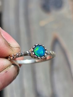 This blue-green Australian opal ring is a size 6, cannot be resized. Wear as a dainty piece or stack to make a statement Stackable Opal Promise Ring, Unique Stackable Opal Ring As Gift, Handmade Opal Promise Ring, Adjustable Blue Opal Ring, Blue Opal Promise Ring, Unique Opal Ring With Birthstone, Green Opal Promise Ring, Adjustable Green Opal Ring, Cabochon Opal Promise Ring Open Style