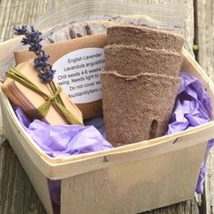 an open box with lavenders, soap and other items in it