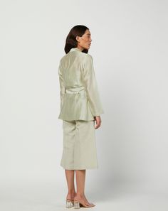 Editor's Note Featuring a green moss silk jacket in silk chanderi and s linen pants with lining. Color: Green Fabric: Silk Chanderi; Linen; Cotton Voile Lining Care: Dry Clean Only Customize Your Outfit Can't find the size you're looking for? No stress. Just select the size "Custom" while adding the item to your cart. We will follow up with you for your body measurements. To request a color or design customizations, please contact our customer care by using our "Ask us a question" form or simply Silk Jacket, Fabric Silk, Green Silk, Cotton Voile, Customer Care, Green Fabric, Linen Pants, Body Measurements, Dresses For Work