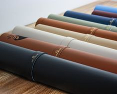 a row of yoga mats lined up on a wooden surface