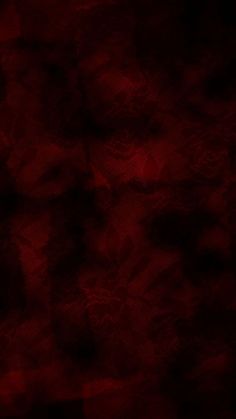 an abstract red background with black spots