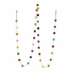 two long necklaces with multicolored beads hanging from the end of each strand