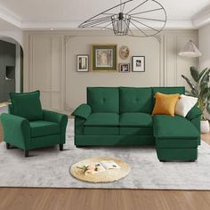 a living room with green couches and white rugs on the wooden flooring