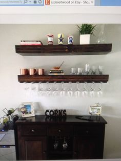 there is a shelf with wine glasses on it