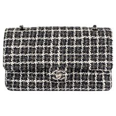 100% authentic Chanel Classic Medium Timeless Double Flap Bag in black, ivory and beige tweed featuring silver-tone hardware. Open pocket on the back. Closes with classic CC-turn-lock on the front. Zipper pocket inside the flap. Outside pocket on the front under the flap. Lined in black calfskin with two open and a lipstick pocket against the back. CC stitching on the inside flap. Has been carried and shows some soft scratches inside the flap. Overall in excellent condition. ca.2004/05 Measurements Model A01112 Height 15.5cm (6in) Width 25.5cm (9.9in) Depth 6.5cm (2.5in) Blindstamp 9494685 All our listings include only the listed item unless otherwise specified in the description above Chanel Classic Medium, Chanel Black And White, Chanel Model, Chanel Vintage, Chanel Black, Black Hardware, Vintage Chanel, Flap Bag, Fashion Handbags