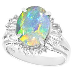 A fine and impressive vintage 2.09 carat opal and 0.89 carat diamond, platinum dress ring; part of our diverse antique jewelry and estate jewelry collections. This fine and impressive opal and diamond cluster ring has been crafted in platinum. The pierced decorated, cluster design is ornamented with a feature 2.09Ct cabochon cut opal panel, four claw set in relief to the center. The opal is flanked on either side by a total of ten individually claw set, graduated tapered baguette cut diamonds. T Cluster Design, Antique Silver Jewelry, Buying An Engagement Ring, Diamond Engagement Ring Set, Dress Rings, Diamond Cluster Ring, Baguette Cut, Black Opal, Antique Jewellery