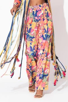 Multi color crepe bralette with floral print, trims and fringes. Paired with floral printed straight pant and jacket with cutwork, trims and fringe detailing. - Aza Fashions Bohemian Party Bottoms With Tassels, Spring Wide Leg Pants With Tassels, Multicolor Bottoms With Tassels For Spring, Spring Multicolor Bottoms With Tassels, Multicolor Floral Print Pants For Festivals, Pants Pattern, Cut Work, Pant Set, Straight Pants