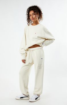 PacSun exclusive! Elevate your loungewear game with the Champion x PAC 1980 Sweatpants, designed for comfort and style. Featuring a high-rise fit with an interior drawstring waistband, side hand pockets, and elastic ankle cuffs, these sweatpants offer a cozy yet tailored look. Complete with a soft-touch PacSun graphic and iconic Champion logo C embroidery, they're the perfect blend of fashion and function for your everyday wardrobe.


	Solid color sweatpants
	High-rise
	Interior drawstring waistband
	Side hand pockets
	Champion C embroidery
	PacSun graphic
	Elastic ankle cuffs
	82% cotton, 18% polyester
	Machine washable
	Model is wearing a size medium
	Model measurements: 5’6” height, 30” bust, 25.5” waist, 36.5” hip Sportswear Lounge Bottoms With Drawstring, Sportswear Loungewear Bottoms With Drawstring, Drawstring Sportswear Bottoms For Loungewear, Drawstring Bottoms For Loungewear Sportswear, Drawstring Bottoms For Loungewear, Sportswear Lounge Pants With Drawstring, Champion Sweatpants Outfit, Sweatpants Outfits Winter, Sweatpants Aesthetic