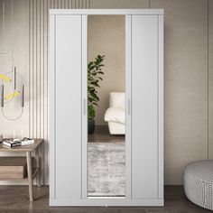 an empty room with a white cabinet and mirror on the wall next to a chair