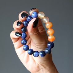 This Carnelian and Sodalite bracelet represents your spirit of passion. Who said spirituality has to be tame? Show off your wild side with colorful Carnelian jewels that kiss calming blue Sodalite. With the Carnelian Sodalite bracelet, you open up your mind to new experiences and your style to a world of fun. Positive Affirmation: "I have spirit with passion" Primary Chakra: Third Eye, Sacral Chakra Intentions: Creativity Crystals STYLE DESCRIPTION Your new bracelet features authentic Carnelian Spiritual Sapphire Beaded Bracelets With Natural Stones, Spiritual Sapphire Beaded Gemstone Bracelets, Handmade Spiritual Sapphire Bracelets, Handmade Sapphire Bracelets In Spiritual Style, Blue Carnelian Spiritual Jewelry, Spiritual Blue Carnelian Jewelry, Blue Carnelian Jewelry As A Gift, Blue Carnelian Jewelry For Gifting, Blue Carnelian Jewelry For Gift