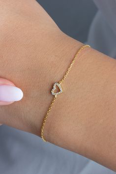 This 14k diamond heart bracelet is a symbol of love. Perfect for layering or to gift someone special.  M A T E R I A L & L E N G T H Available in 14k Yellow Gold, 14k Rose Gold, 14k White Gold Stone: Natural Diamond Heart Measurements: 11 mm x 9 mm Diamonds: .10 ct tw Bracelet length: 6+1 inches (Please let us know if you prefer a different length) Color: G  Quality: SI-VS Additional Notes: * Non-Conflict Diamonds * Made in the USA E X C H A N G E / R E T U R N ∙ P O L I C Y Please let us know within 7 days of receipt. Ship the item back to us in its original condition. Get a full refund. Personalized items can be exchanged with 20% restocking fee. Full eternity bands can be exchanged with 15% restocking fee. Azalea Jewelry will cover return shipping cost if there is an issue with the item Bracelet Fancy, Bracelet Dainty, Gold Diamond Jewelry, Wedding Jewelry Bracelets, Initial Bracelet, Special Jewelry, Gold Stone, Bezel Diamond, Love Symbols