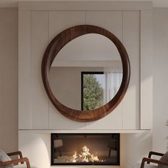 a living room with a fire place and a round mirror on the wall above it