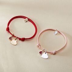 Our Personalized Valentines Heart Bracelet is a sweet symbol of love and affection, perfect for Valentine's Day and beyond. Each bracelet features two charms: a dainty and romantic mini red heart, and a shiny heart charm to hand-engrave with the name of a true love. Both charms move freely along your choice of colorful braid.18K Champagne Gold Plated or 925 Sterling SilverHeart: 0.4x 0.4Mini Red Lacquer Heart: 0.25 x 0.21Braid made of a durable, colourfast polyesterFully adjustable sliding knot Love And Affection, Red Lacquer, Engraved Bracelet, Sliding Knot, Personalized Valentines, Valentine Heart, Champagne Gold, Love Symbols, Sterling Silver Heart