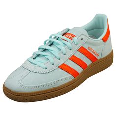 Step up your streetwear game with these adidas Handball Spezial trainers in a vibrant Aqua Orange. Crafted from a sleek combination of suede and synthetic materials, they offer both style and durability. The textile lining and insole ensure all-day comfort, while the classic lace-up fastening provides a secure fit. Complete with a rubber sole for lasting traction, these eye-catching trainers are perfect for adding a bold touch to any outfit. Style: HANDBALL SPEZIAL Outer: Suede & Synthetic Linin Adidas Samba Outfit, Fashion Trainers, Adidas Handball Spezial, Adidas Handball, Orange Sneakers, Aqua Shoes, Trainers Fashion, Synthetic Materials, Outfit Style