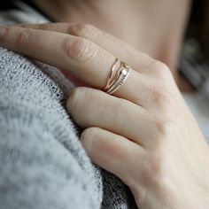 This delicate yet striking ring is made from one piece of hammered metal which wraps one and a half times around your finger, giving the appearance of two wavey stacking rings, yet maintaining the negative space between each band. The ring is wrapped and then soldered closed so it maintains both its shape and size. It has a lovely subtle hammered texture which adds dimension and sparkle. Available in sterling silver and 14k gold fill, as well as solid 14k gold in yellow and rose. sizes 5-9. All Two Rings, Half Time, Wrap Ring, Hammered Metal, Wrap Rings, Rings Simple, Negative Space, Stacking Rings, Gold Filled