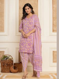 This 3-piece set includes purple & yellow floral print straight shape kurta has round-neck, 3/4th sleeves, straight hem, knee length teamed with printed dhoti pants with elasticated waistband & slip on closure and a dupatta. The model wearing the size small is 5'8 in height. 3 Piece Set Color-Purple & Yellow Suit Fabric- Cotton Dupatta Fabric-Cotton Work - Floral Print detailing Neck - V Neck Sleeves - 3/4th sleeves Length-Knee Length Bottom - Printed Trouser Bottom - Elasticated Waistband & Slip-on Closure Washing Care-Hand Wash The model height 5'8 is wearing a size small Purple Straight Kurta Set For Spring, Traditional Purple Sets For Spring, Purple Cotton Sets With Printed Motifs, Purple Floral Print Sets For Eid, Purple Cotton Straight Kurta Salwar Kameez, Purple Cotton Salwar Kameez With Straight Kurta, Traditional Purple Lawn Suit For Summer, Purple Cotton Kurta With Dupatta, Purple Straight Kurta With Printed Motifs