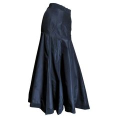 A beautiful black silk taffeta skirt from Angelo Tarlazzi. It has a grosgrain waistband and vertical panels semi fitted though to the hips then flaring to the hem. The skirt has grosgrain around the hem also and it is unlined with a center back zipper and a button at the waist. Fits Extra Small, Small. Waist 25" Hips 37" Length 38.50" Taffeta Skirt, Silk Maxi Skirt, Slim Aarons, Silk Maxi, Silk Taffeta, Small Waist, Black Silk, Tiffany & Co., Yves Saint Laurent