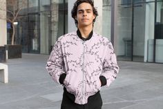 Introducing our Men's Bomber Jacket, a cool fusion of style and comfort. This all-over print jacket in trendy pink is adorned with bold black floral graphics, making it a standout piece for fashion-forward men. Whether you're aiming to make a statement or searching for the perfect gift for your boyfriend, this jacket with its unique floral design is a versatile addition to any wardrobe. Crafted for both fashion and functionality, this pink bomber jacket adds a touch of edgy sophistication to casual and formal ensembles alike. Elevate your style effortlessly - order now and embrace the vibrant charm of this must-have jacket! .: Material: 100% polyester .: Full front metal zipper closure .: Two lined welt pockets at front .: Dark blue polyester lining .: Sewn in label .: Seam thread color au All Over Print Long Sleeve Streetwear Outerwear, Printed Cotton Outerwear For Streetwear, Casual Pink Outerwear With Graphic Print, Urban Style Pink Cotton Outerwear, Pink Cotton Urban Outerwear, Urban Style Pink Long Sleeve Outerwear, Pink Long Sleeve Urban Outerwear, Casual Printed Cotton Outerwear, Casual Cotton Printed Outerwear